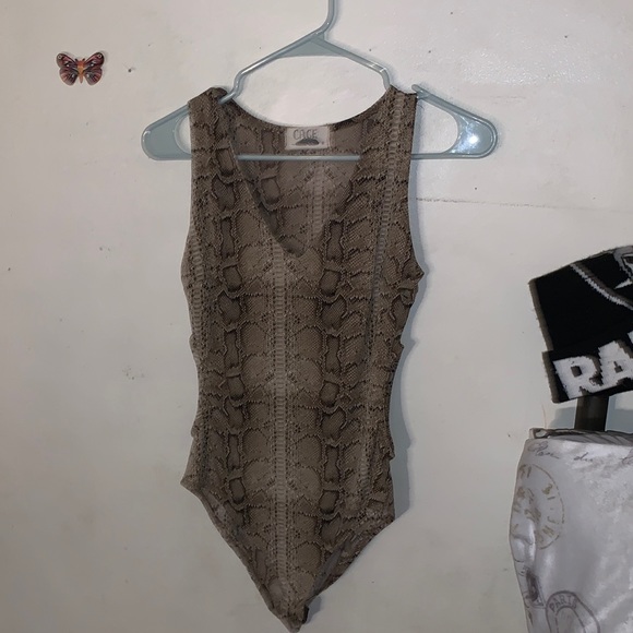 Other - this is a body suit is from cage and it’s in good condition a medium